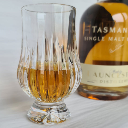 Linear Cut Crystal Whisky Glass and Bottle of Whisky